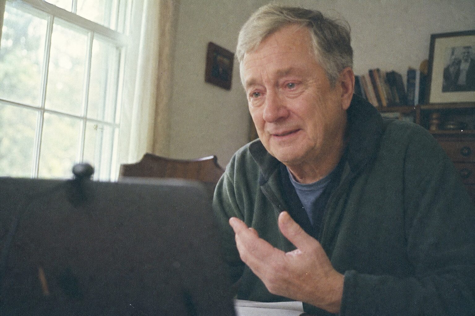An elderly man and a middle-aged woman meeting for the first time over a video call
